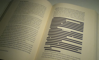 A book page with lines blacked out                  