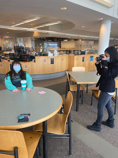 Elisa Wilson, one of the senior editors for the Yearbook (in Pennridge Library ready to take some pictures for Yearbook)