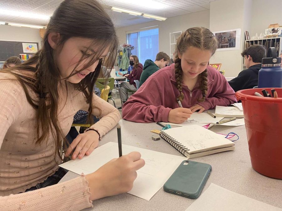 Freshman, Annalise Lainteigne and Phoebe Anton, drawing in Mrs.Troutmans art class.