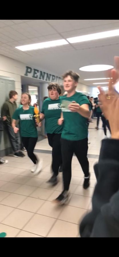 Pennridge Unified Bocce players parade through the halls during the torch run