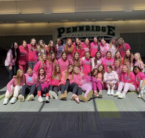 Pennridge womens Lacrosse team wearing pink for Mrs. Fehers Baby girl on game day.