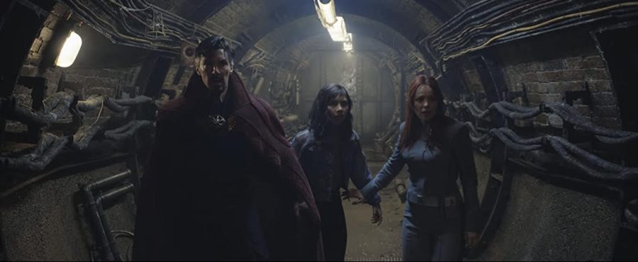 Doctor Strange, America Chavez, and Christine Palmer cornered by the Scarlet Witch.