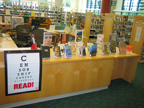 Banned and challenged books displayed at a public library.
