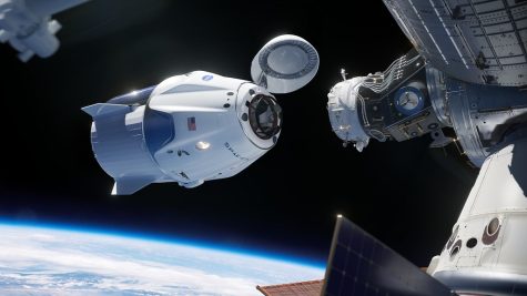 A commercial space capsule connecting to a space station. https://www.flickr.com/photos/nasakennedy/42840169205