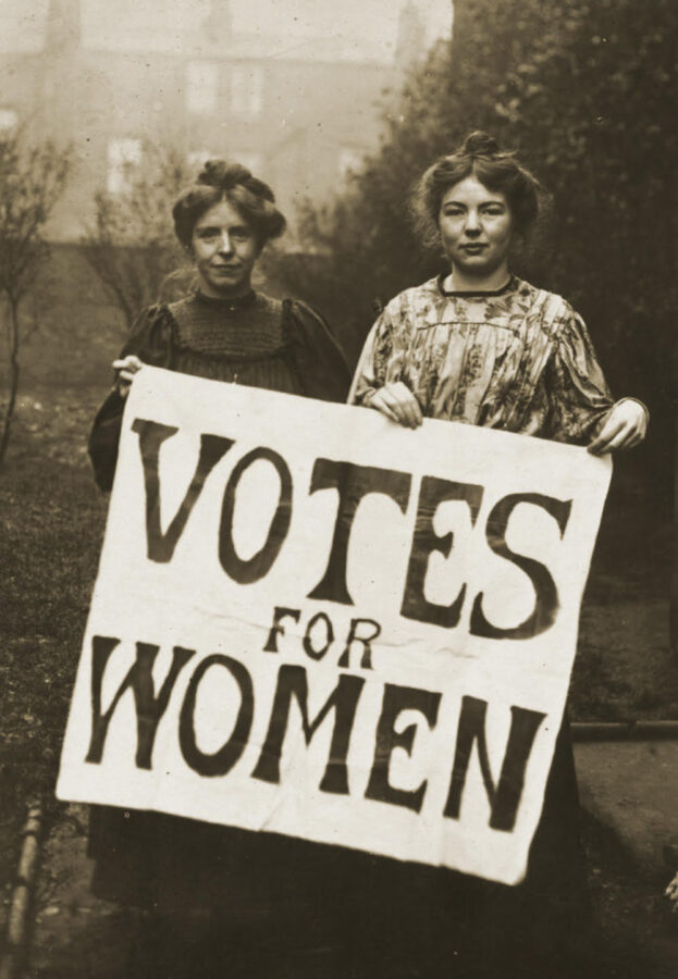 Suffragists holding sign for womens rights.