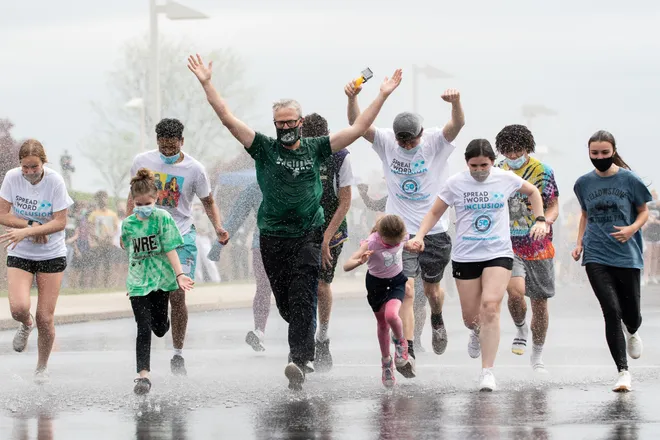 Dr. Bolton runs through the showers during 2021, showing Pennridges support for inclusion and displaying the first of many April Showers.

https://www.phillyburbs.com/story/news/2021/05/04/pennridge-high-makes-splash-celebrates-sports-inclusion-efforts-special-olympics-pennsylvania/4920103001/