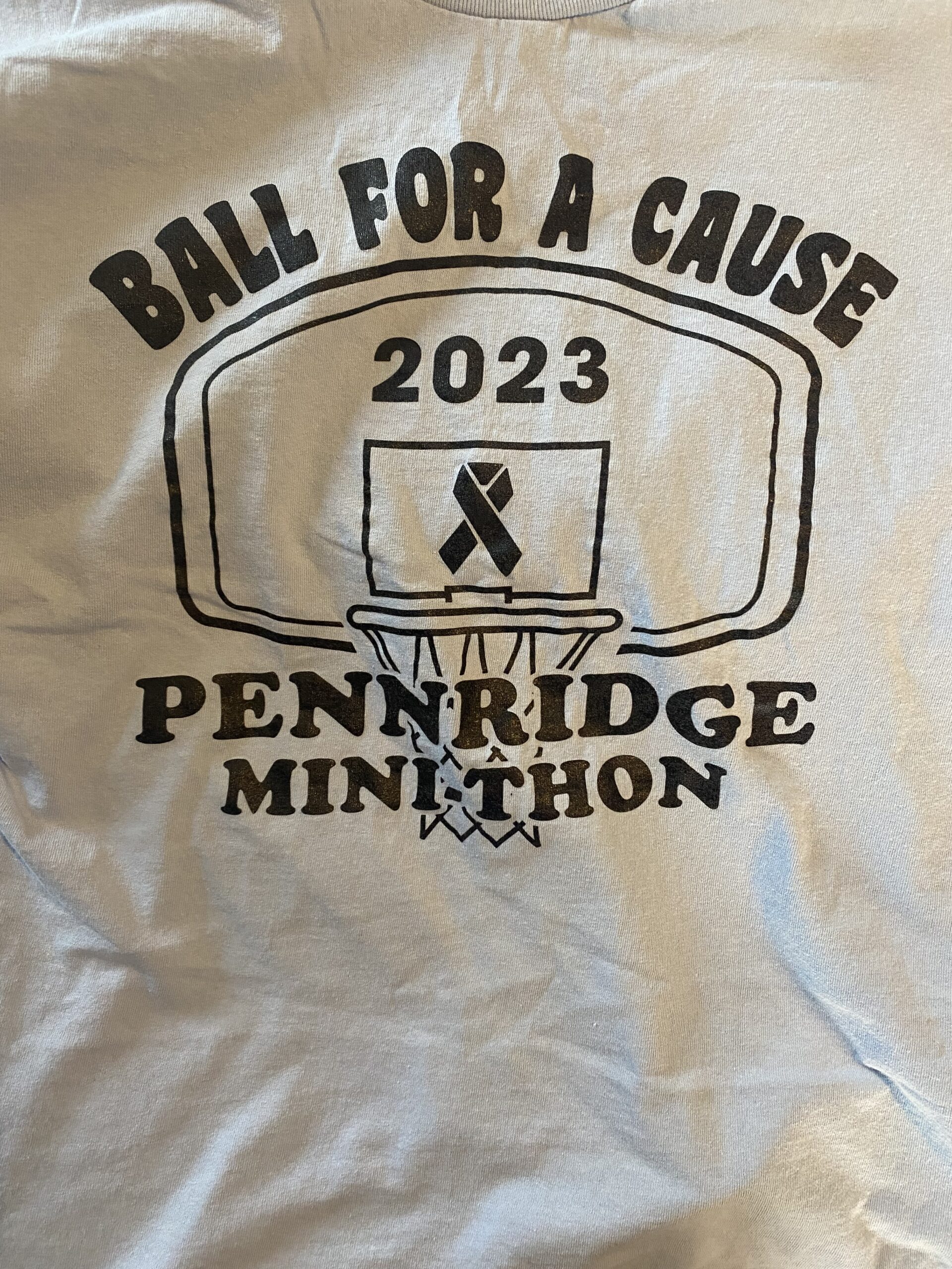 The T-shirt logo for Pennridge Mini- THONs ball for a cause event which helped raise money towards the $28,000 total
