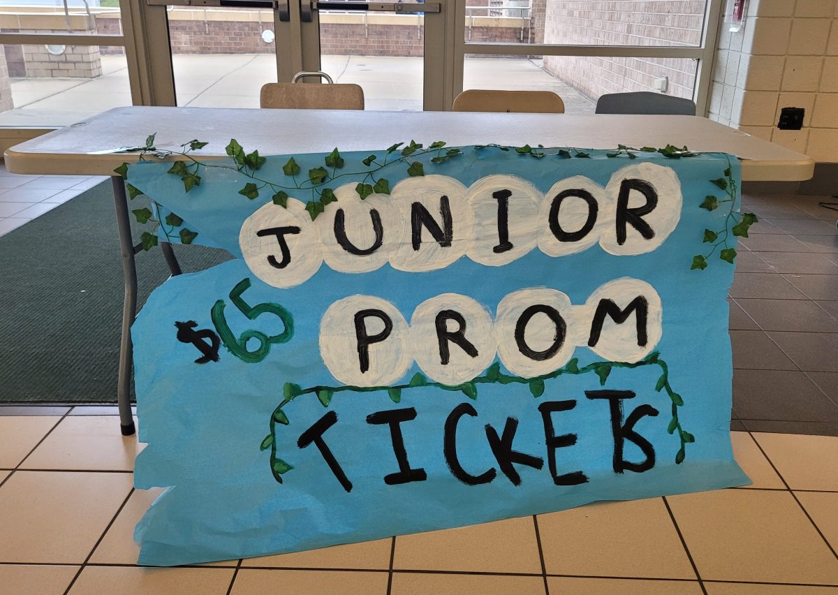 The+table+in+the+Pennridge+High+School+cafeteria+is+set+up+to+sell+the+junior+prom+tickets.+