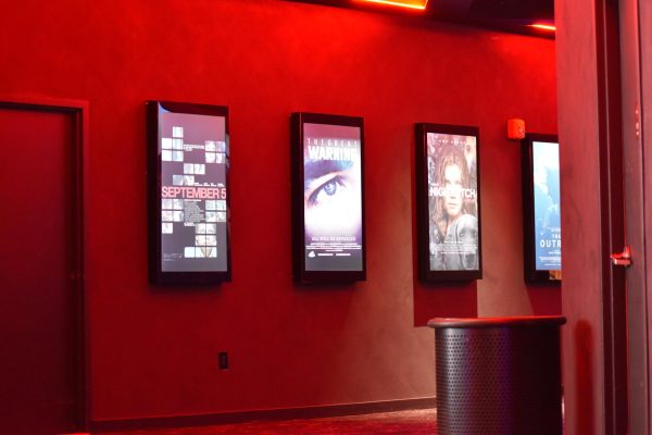 The photo shows posters for upcoming movies at the Regal Warrington Cinema.