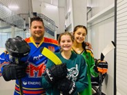 Mike Hawkins (Left), Molly Hawkins (Center) and
Emma Hawkins (Right) ready to go on the ice 
