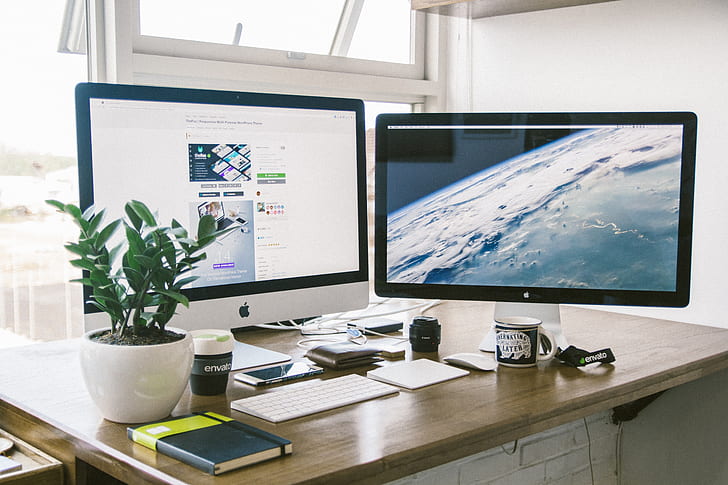 The image shows a typical office desk setup for someone working at home. 

