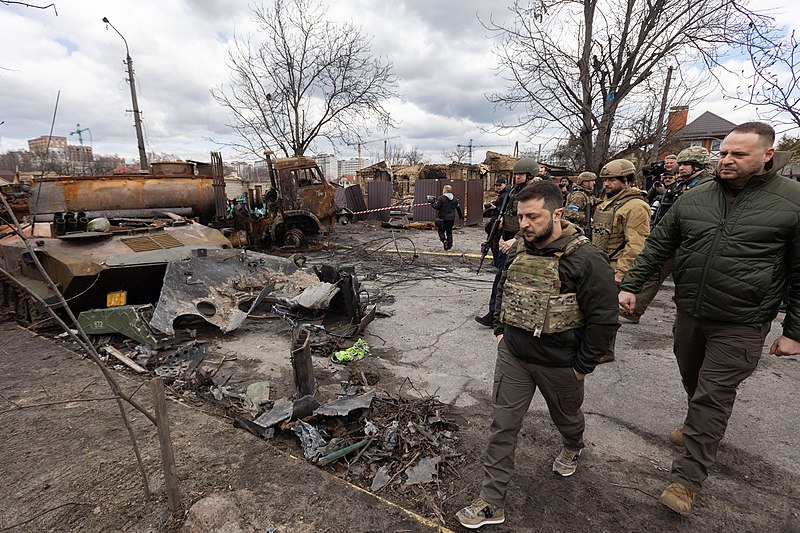 The photo shows the aftermath of the Bucha massacre, a Russian invasion of Ukraine that caused the death of dozens of civilians. President Zelenskyy can be seen wearing the camo backpack.
Taken on April 4, 2022. 
