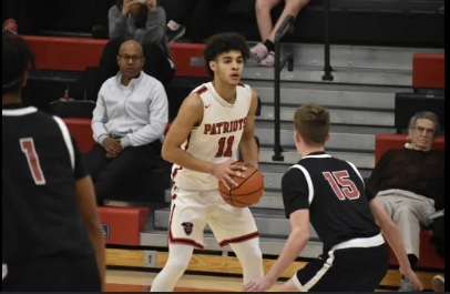 Picture of Bryce Rollerson and his Father in the background