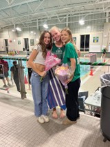 Fans support Laney Sayre (middle)
as she celebrates Senior Night
