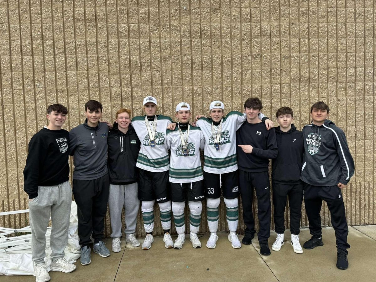 Capture of friends taking a group photo after the State final win last year