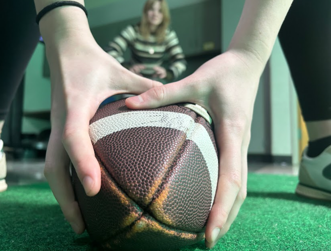 Person holding football