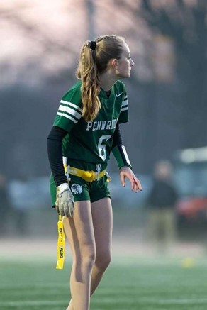 Sophia playing flag football