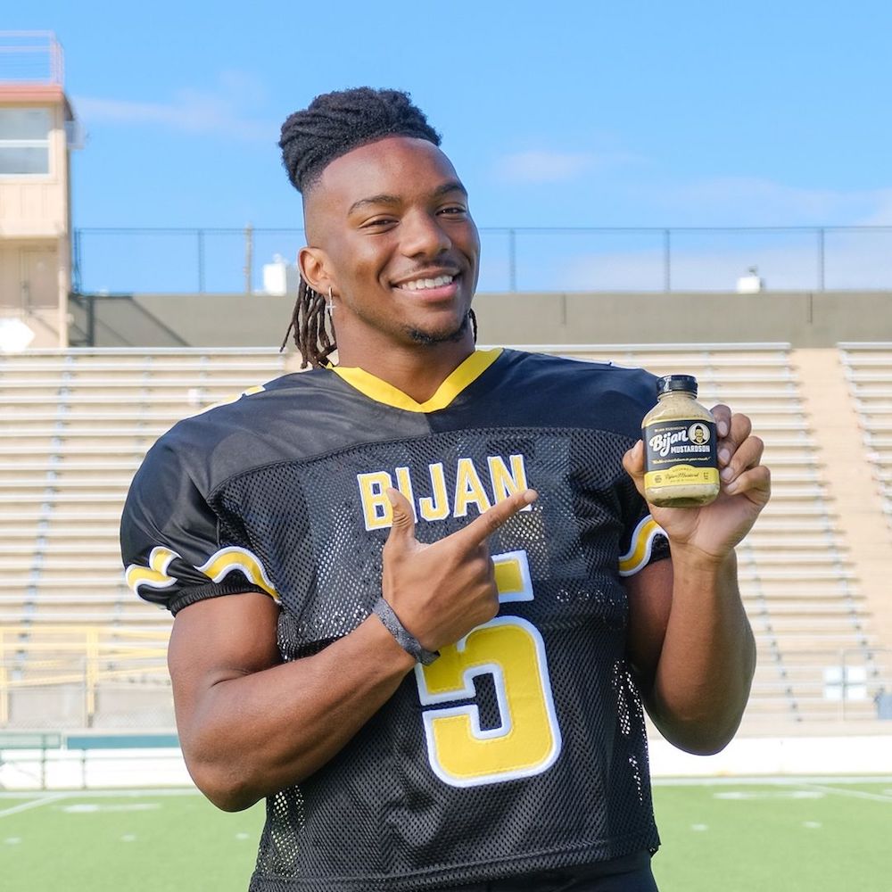 College athlete Bijan Robinson shows off NIL deal with personal mustard brand