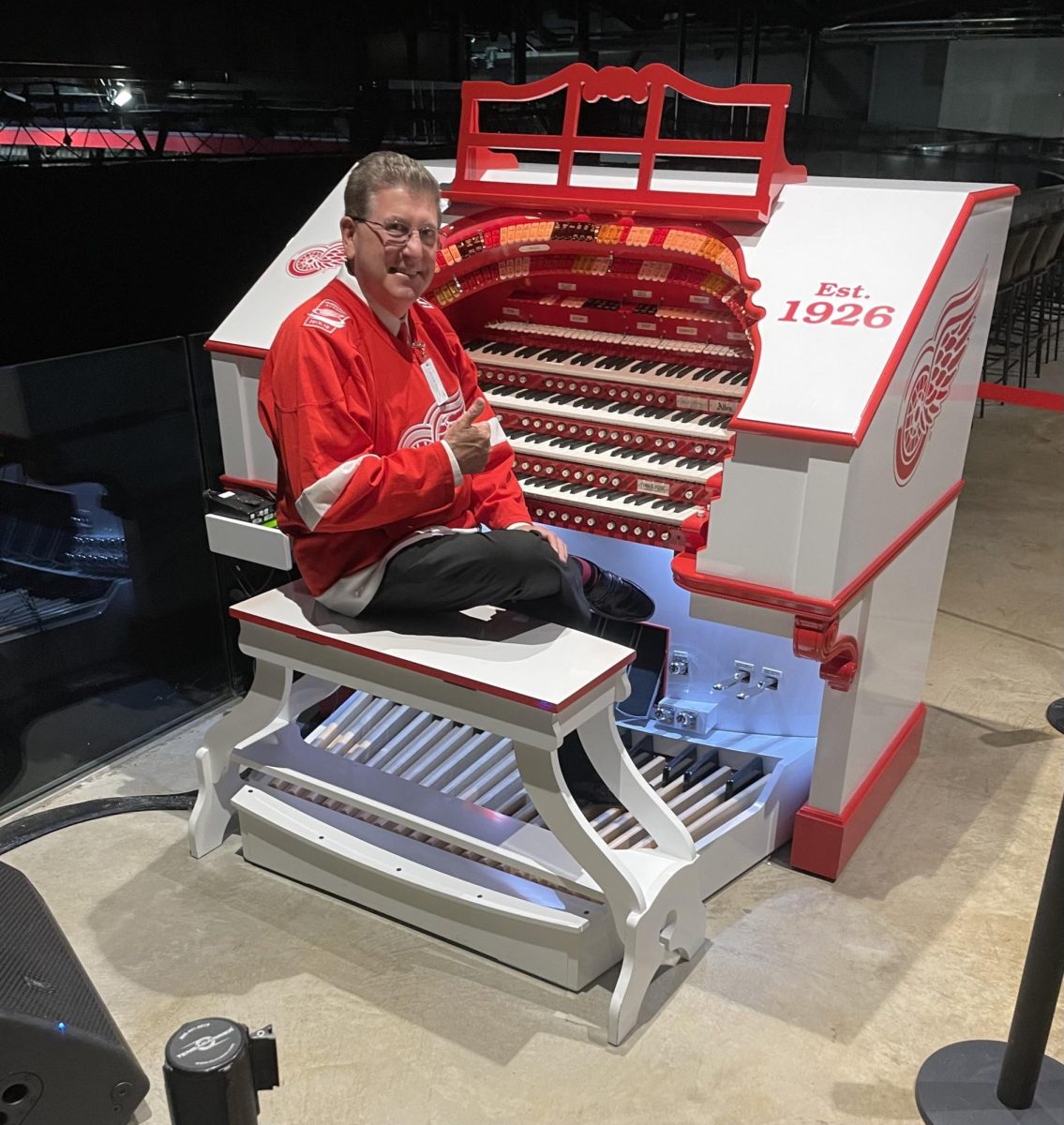 Lance Luce seated at the Allen STR-4 Organ at Little Caesars Arena in Detroit, Michigan.
