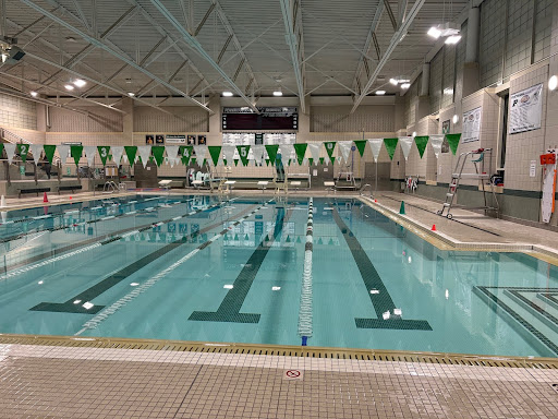 Pennridge Rams girls swim team prepares in the natatorium for a match that they will go on to win 125-53.