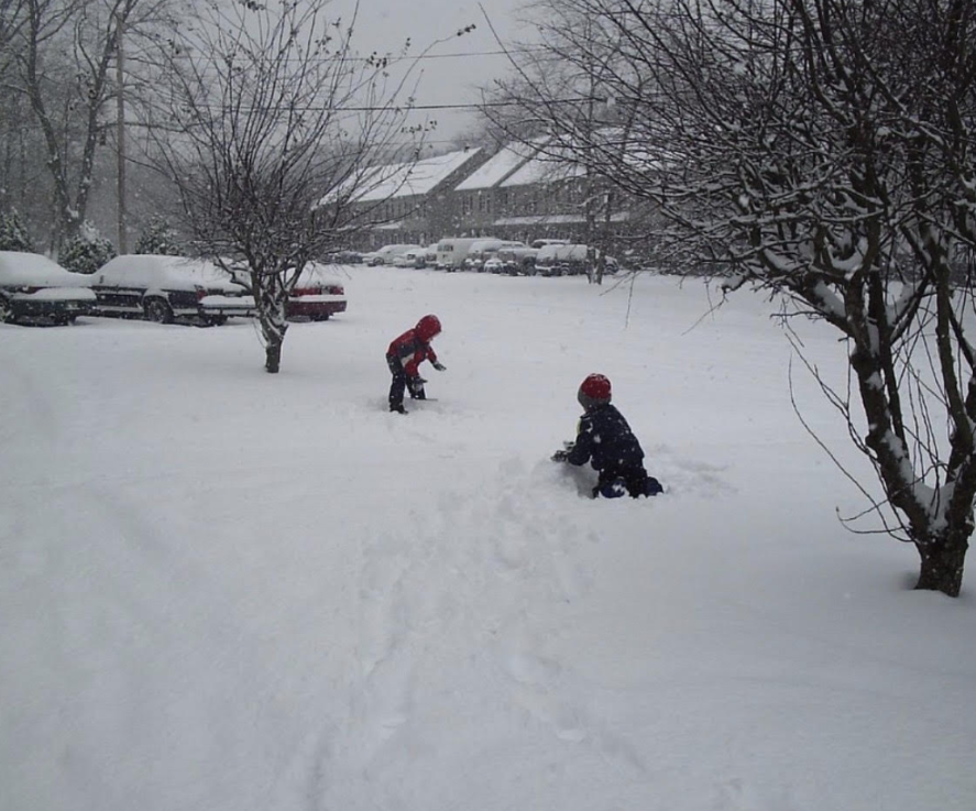 Two kids having fun in the snow