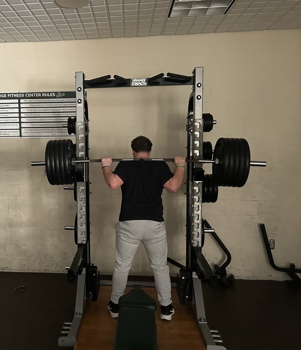 Pennridge High School senior Track and Field athlete, Loagen Ruckdeschel, goes to lift a personal record during a practice.