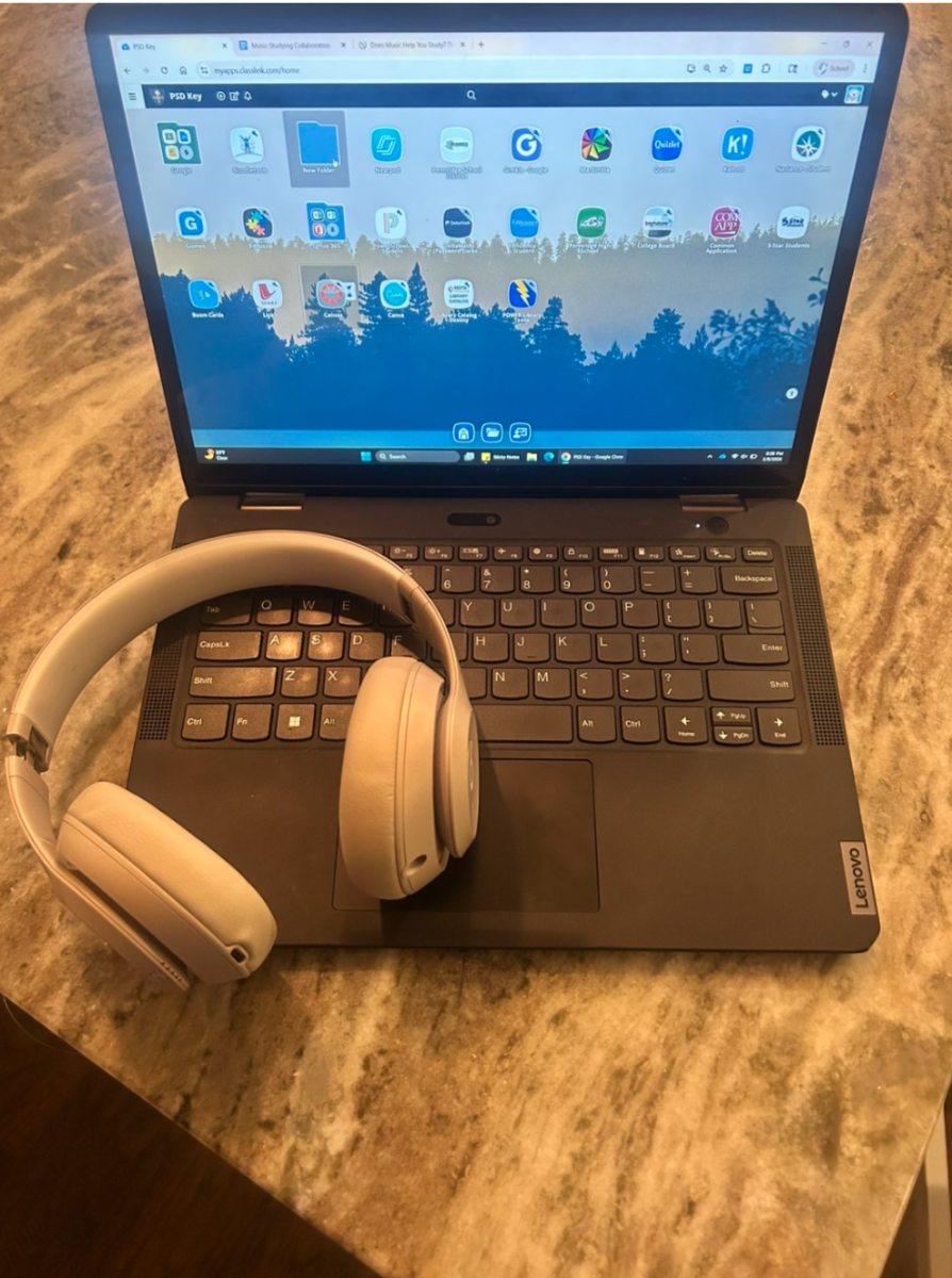 A studying setup featuring headphones for music.