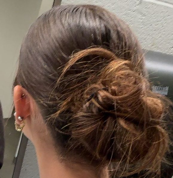 One of the hairstyles mentioned in this article, a slick back bun.