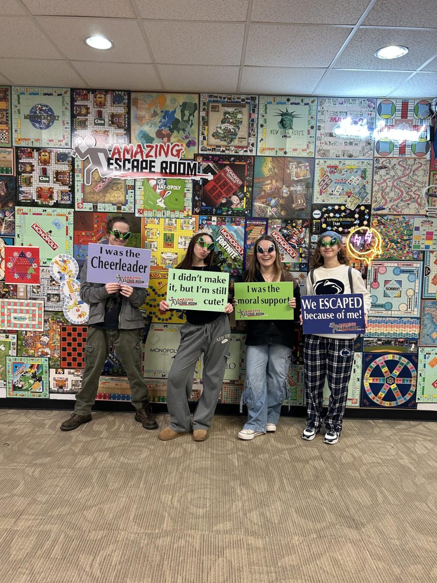 After escaping the room, the newsgroup had fun taking photos with fun props and signs