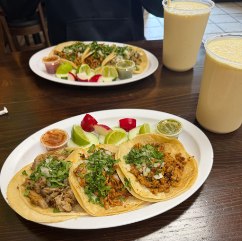 A carnita, chorizo, and al pastor taco, as well as a mango smoothie; each of them were recommended by the chef.