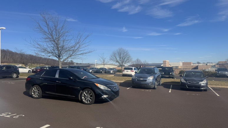 A teen driver driving in the student parking lot at Pennridge High School
