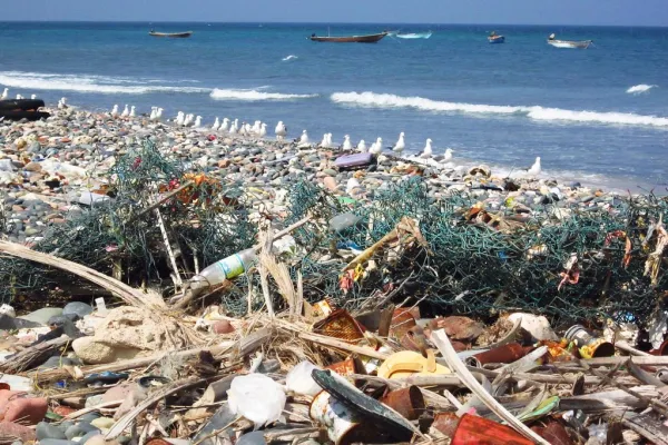 Trash on the beach showing the pollution of our ocean