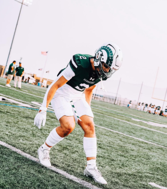 Chase Clontz during warm-ups, preparing to play both sides of the football, during the game.