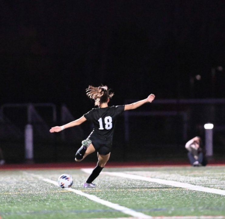 Avery Runk taking a free kick during a home game for Pennridge Women's Soccer.