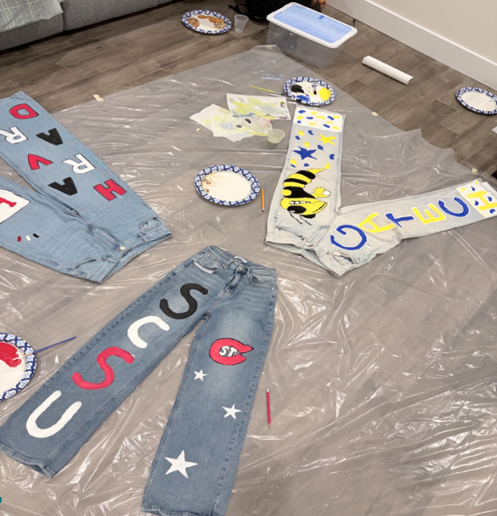 Pennridge High School seniors decorate their jeans with their future colleges to celebrate graduation.
